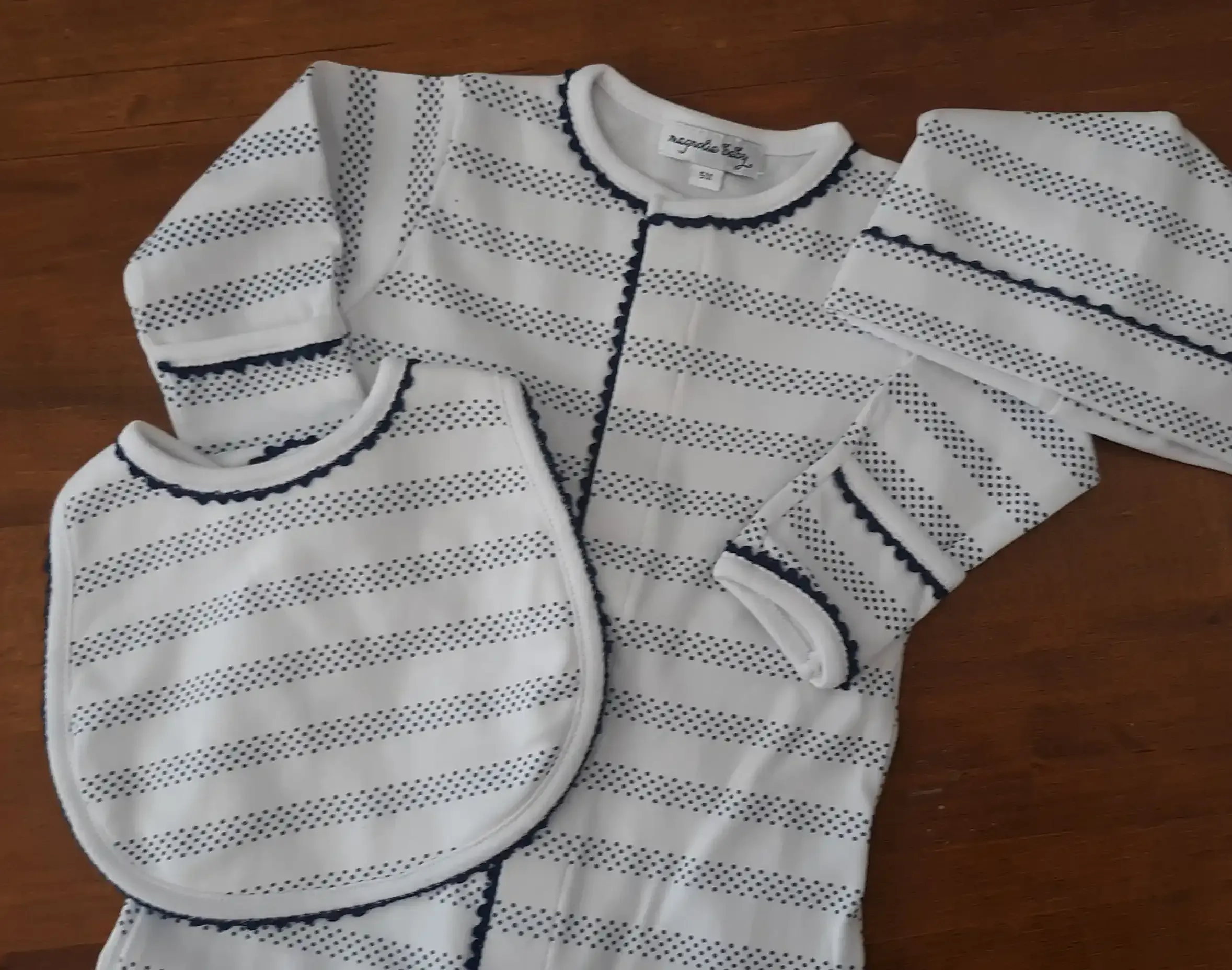 Navy and white striped infant convertible gown with a matching bib