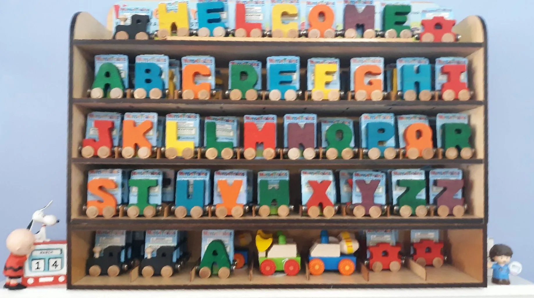 Shelf of Maple Landmark wooden alphabet name train letters spelling WELCOME