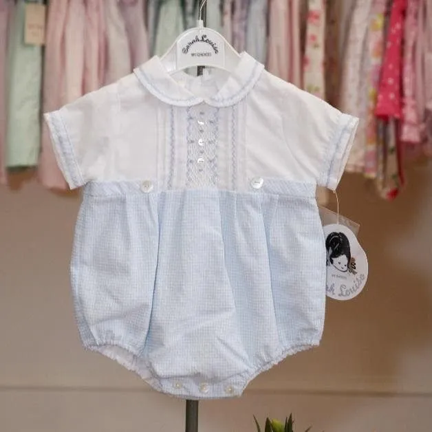 Sarah Louise blue gingham baby romper with a white pintucked top on a hanger